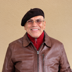 Man wih glasses wearing a beret